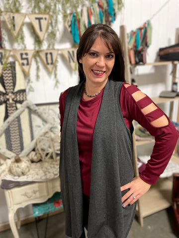 Sleeveless grey cardigan with pockets
