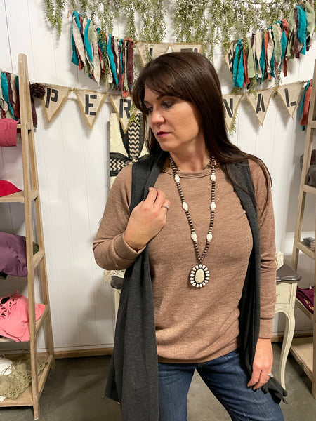 Sleeveless grey cardigan with pockets